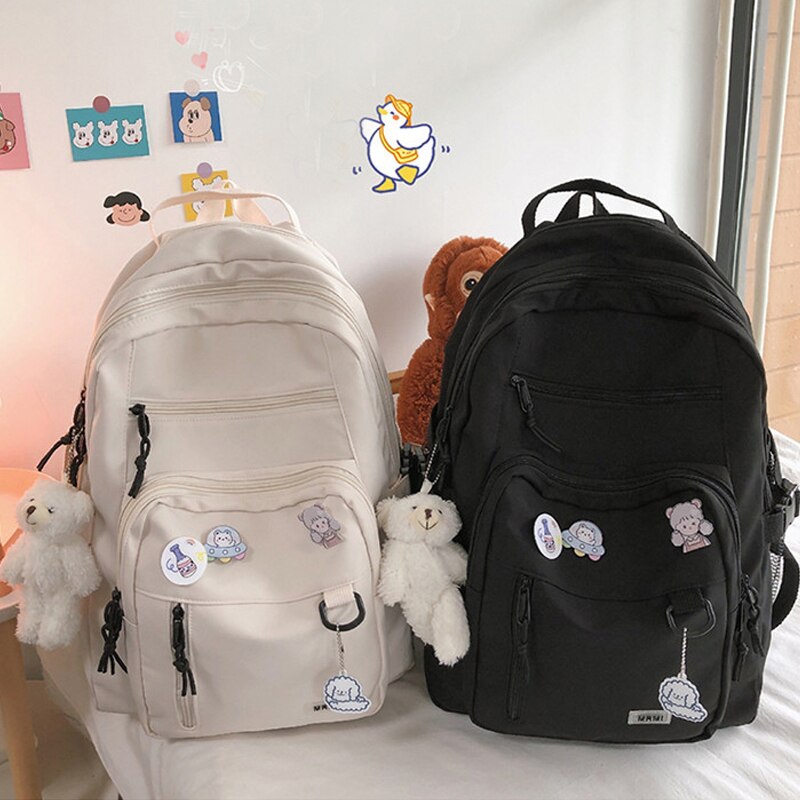 Spacious School Backpack – With Stylish Pins and Keychain 7